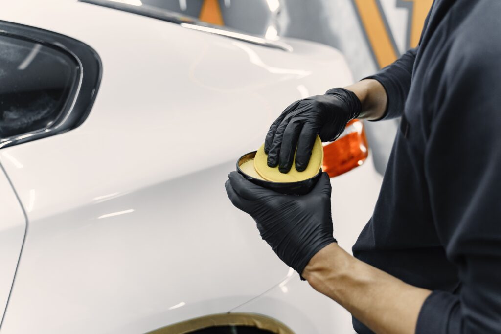 man-polish-car-garage